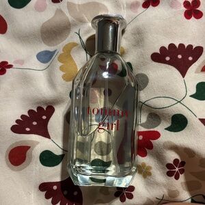 Tommy Hilfiger Clear Perfume Bottle with Silver Cap and Red Text